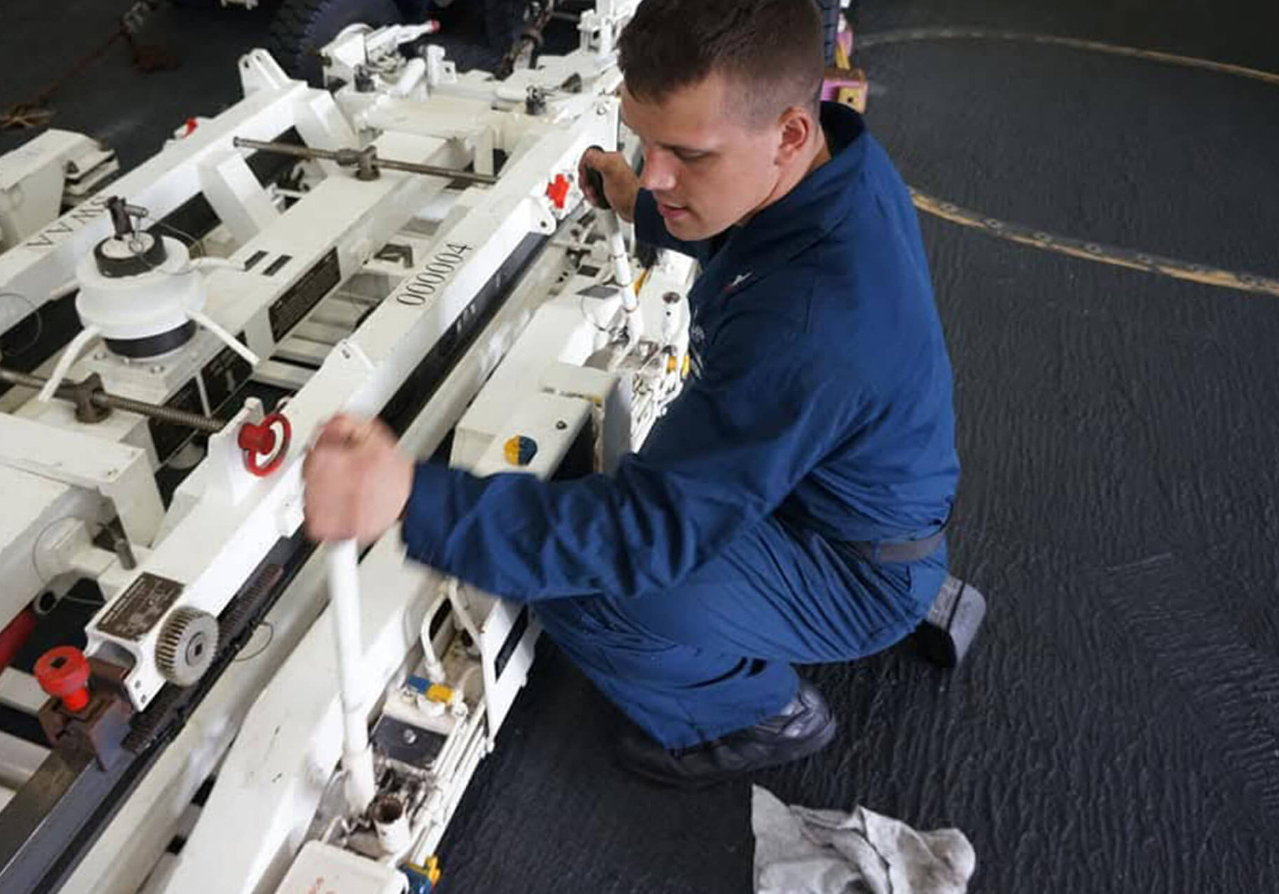 Josh Seley, Deckplate Diesel, during his time in the Navy. Operating machinery.